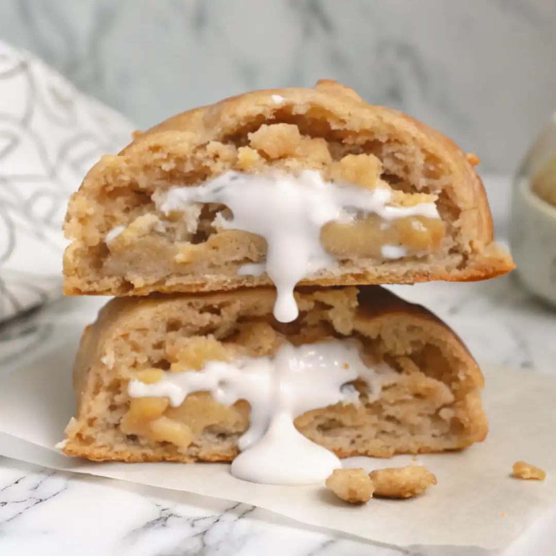 Coconut Ranger Cookies fresh from oven on rustic board