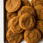 Chewy maple pumpkin cookies with spiced sugar on a rustic table