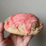 Cherry Pop-Tart Cookies stuffed with cherry pie bars, topped with pink glaze and sprinkles
