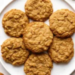 Chewy oatmeal cookies on cooling rack.